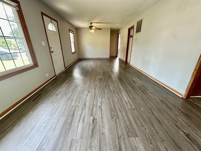814 Spruce Ct, Streamwood, IL 60107 - unfurnished living room with dark wood-style flooring and ceiling fan