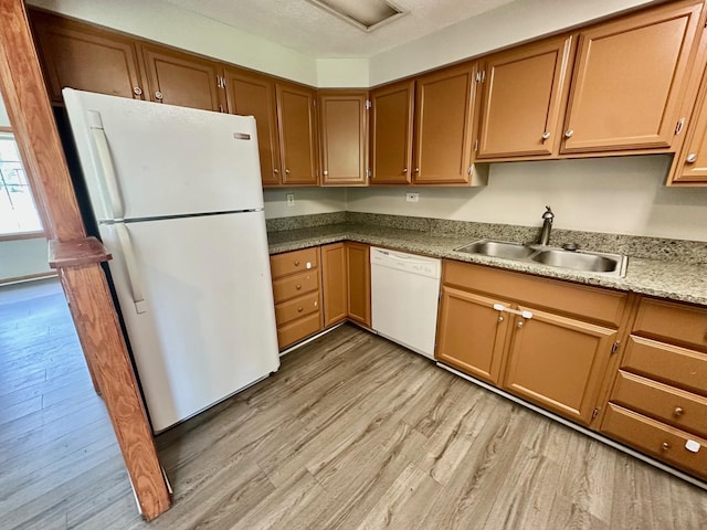 814 Spruce Ct, Streamwood, IL 60107 - kitchen with white appliances, light wood finished floors, brown cabinetry, and light countertops