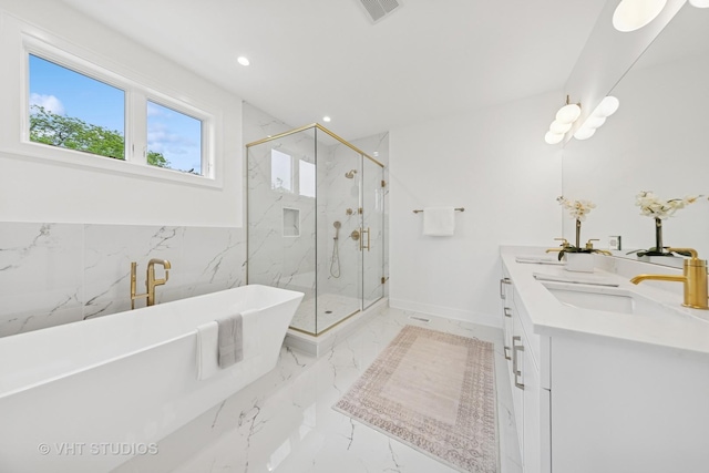 3300 S Giles Ave, Chicago, IL 60616 - bathroom with double vanity, a soaking tub, a marble finish shower, marble tiled floors, and recessed lighting
