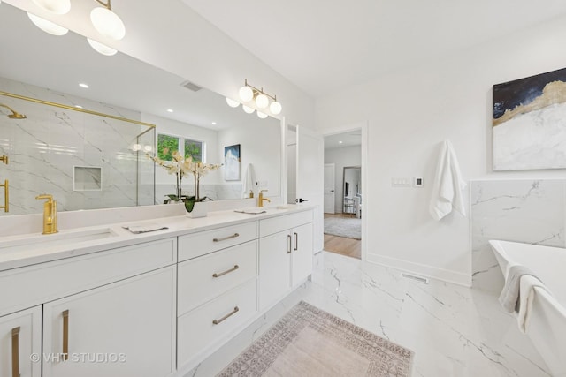 3300 S Giles Ave, Chicago, IL 60616 - full bathroom featuring double vanity, a marble finish shower, a soaking tub, marble tiled floors, and recessed lighting