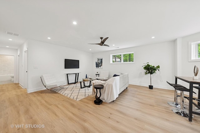 3300 S Giles Ave, Chicago, IL 60616 - living room featuring light wood finished floors, plenty of natural light, ceiling fan, and recessed lighting