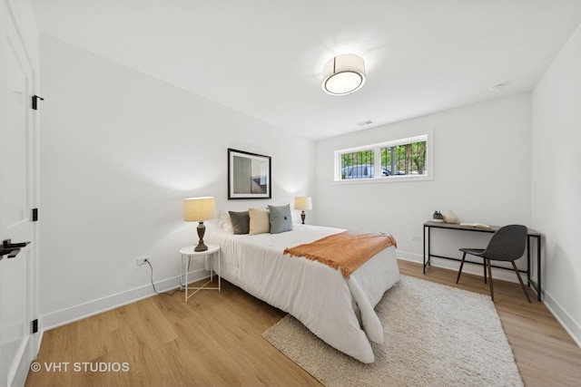 3300 S Giles Ave, Chicago, IL 60616 - bedroom featuring light wood-type flooring and baseboards