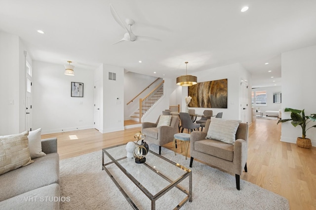 3300 S Giles Ave, Chicago, IL 60616 - living area featuring stairway, light wood finished floors, a ceiling fan, and recessed lighting