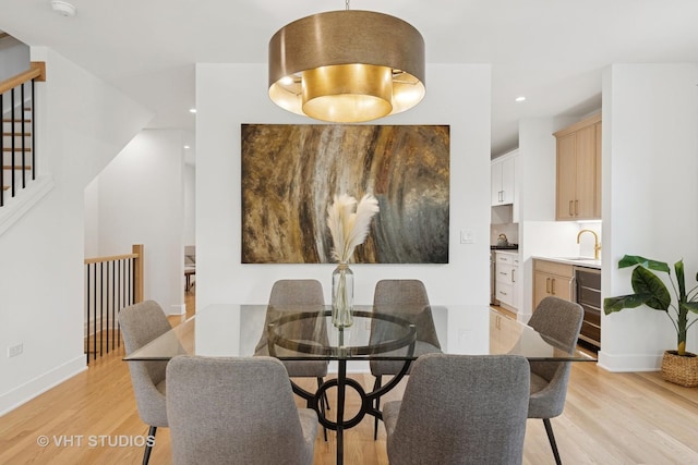 3300 S Giles Ave, Chicago, IL 60616 - dining space with light wood-style flooring, stairway, and recessed lighting