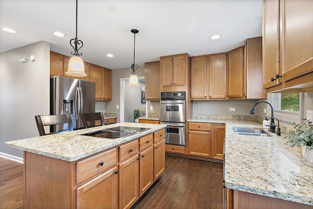1560 Kensington Dr, Algonquin, IL 60102 - kitchen featuring stainless steel appliances, a sink, dark wood finished floors, a kitchen island, and light stone counters
