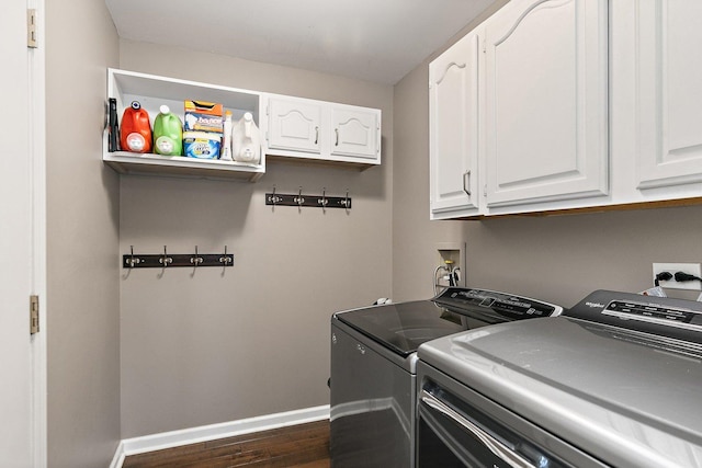 1560 Kensington Dr, Algonquin, IL 60102 - laundry room featuring washing machine and dryer, dark wood-style floors, cabinet space, and baseboards
