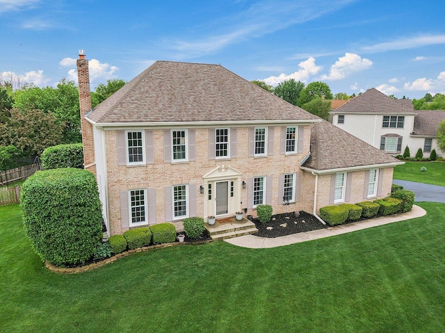 1560 Kensington Dr, Algonquin, IL 60102 - colonial house with a chimney, a shingled roof, and brick siding