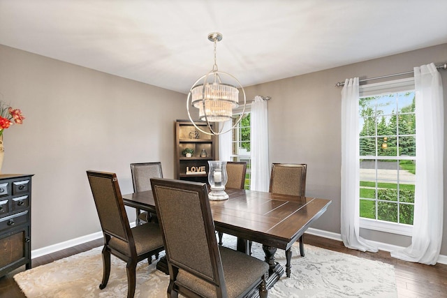 1560 Kensington Dr, Algonquin, IL 60102 - dining space with a chandelier, plenty of natural light, wood finished floors, and baseboards