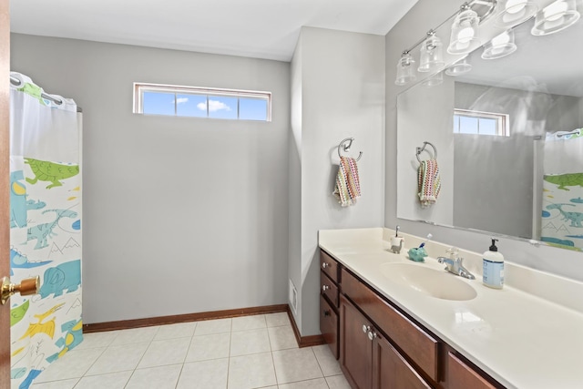7008 Century Ct, Tinley Park, IL 60477 - bathroom featuring vanity, plenty of natural light, baseboards, and tile patterned flooring