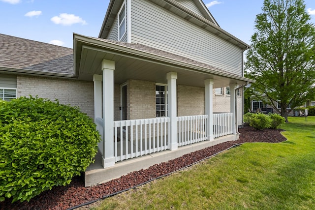 7008 Century Ct, Tinley Park, IL 60477 - view of property exterior featuring a porch, brick siding, a lawn, and a shingled roof