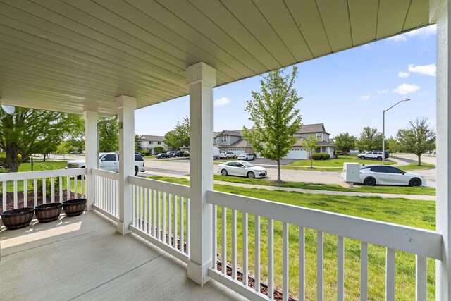 7008 Century Ct, Tinley Park, IL 60477 - porch featuring a residential view and a lawn