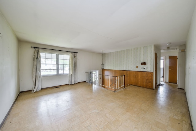 323 Mark Ave, Glendale Heights, IL 60139 - spare room featuring light flooring, wallpapered walls, and baseboards