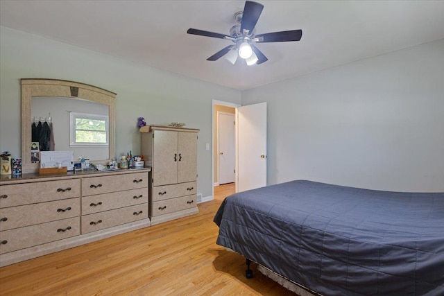 8353 N Drake Ave, Skokie, IL 60076 - bedroom with light wood-type flooring and a ceiling fan