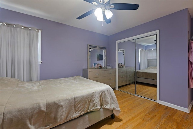 8353 N Drake Ave, Skokie, IL 60076 - bedroom with light wood-type flooring, a closet, ceiling fan, and baseboards