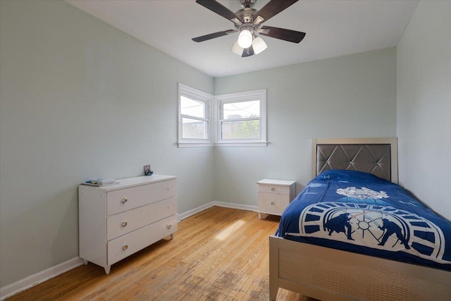 8353 N Drake Ave, Skokie, IL 60076 - bedroom with light wood-style flooring, baseboards, and a ceiling fan