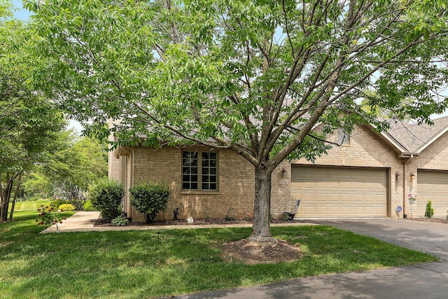 20142 Crystal Lake Way, Frankfort, IL 60423 - obstructed view of property featuring concrete driveway, an attached garage, a front yard, and brick siding