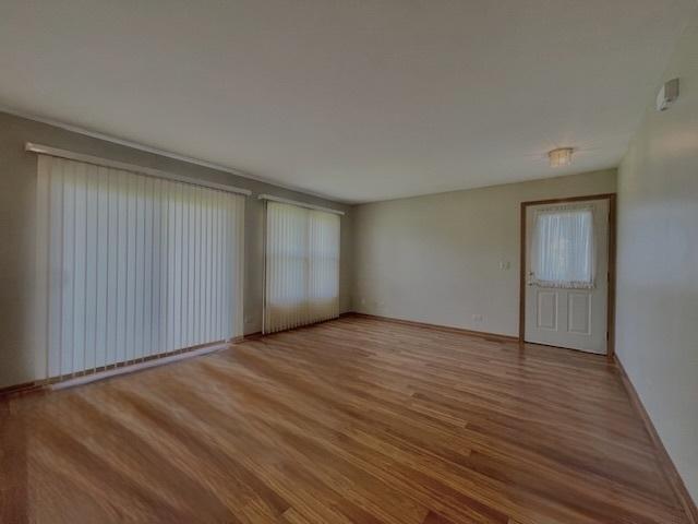 304 University Ln Unit 5, Elk Grove Village, IL 60007 - unfurnished bedroom with a closet, carpet flooring, and baseboards