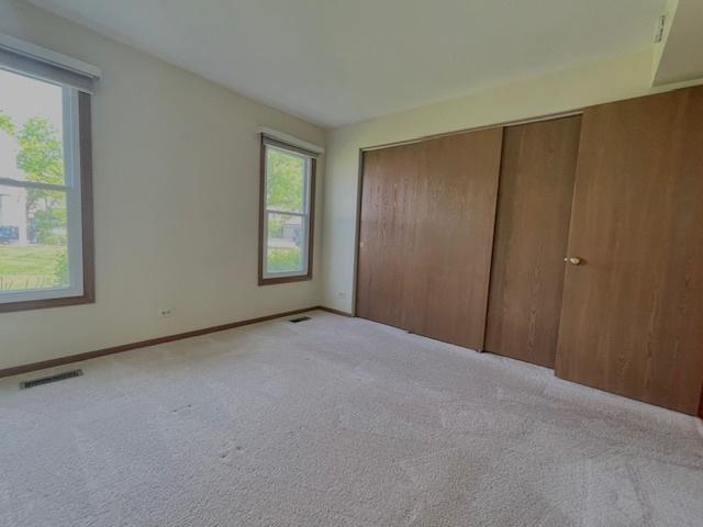 304 University Ln Unit 5, Elk Grove Village, IL 60007 - full bath featuring vanity, toilet, tub / shower combination, and tile patterned floors