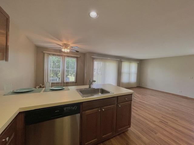 304 University Ln Unit 5, Elk Grove Village, IL 60007 - kitchen with a sink, dishwasher, light countertops, wood finished floors, and recessed lighting