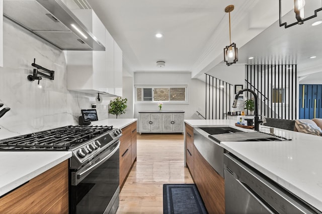 2705 Cuyler Ave, Berwyn, IL 60402 - kitchen featuring stainless steel appliances, range hood, modern cabinets, brown cabinets, and light wood-style flooring