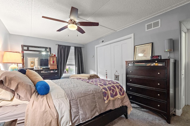 15713 Orlan Brook Dr Unit 97, Orland Park, IL 60462 - carpeted bedroom featuring a textured ceiling, a closet, and ceiling fan