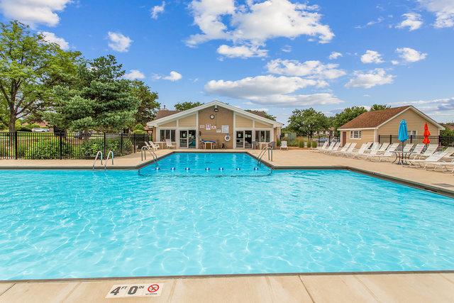 15713 Orlan Brook Dr Unit 97, Orland Park, IL 60462 - community pool featuring a patio area