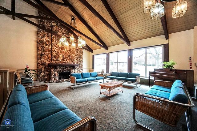 15713 Orlan Brook Dr Unit 97, Orland Park, IL 60462 - common area featuring a wooden ceiling with exposed beams and high vaulted ceiling