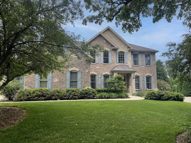 647 Oak Ln, South Elgin, IL 60177 - colonial house featuring brick siding and a front yard