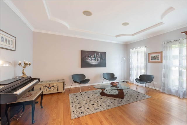 647 Oak Ln, South Elgin, IL 60177 - living area with a raised ceiling, wood finished floors, ornamental molding, and baseboards