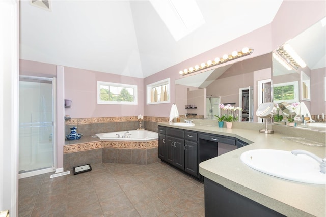 647 Oak Ln, South Elgin, IL 60177 - bathroom with double vanity, a garden tub, a shower stall, tile patterned floors, and vaulted ceiling
