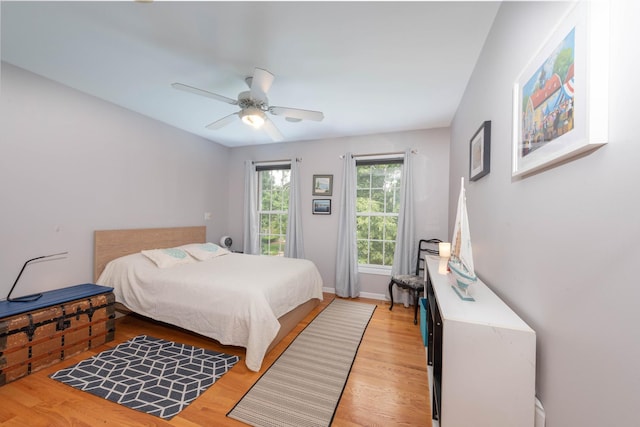 647 Oak Ln, South Elgin, IL 60177 - bedroom featuring light wood-style floors, ceiling fan, and baseboards
