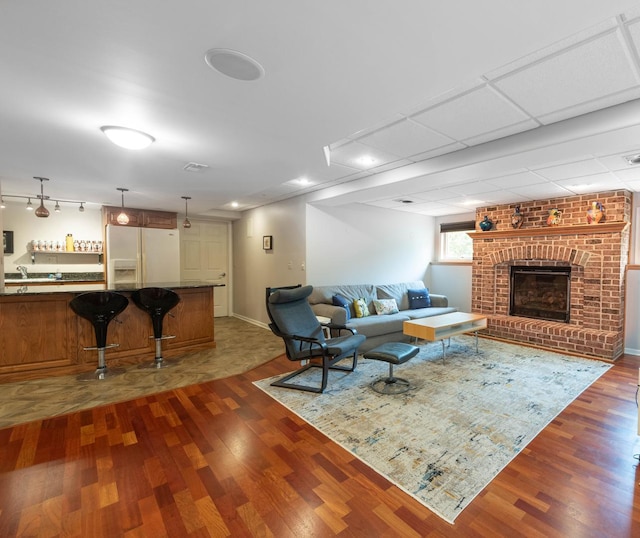 647 Oak Ln, South Elgin, IL 60177 - living area with dark wood finished floors, baseboards, and a fireplace