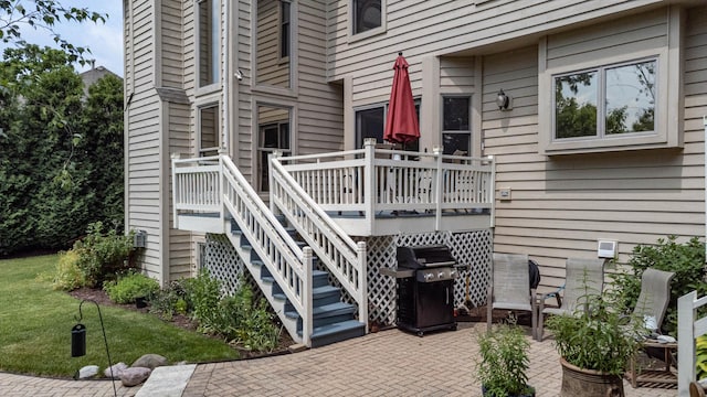 647 Oak Ln, South Elgin, IL 60177 - view of exterior entry with a patio, a deck, and a yard