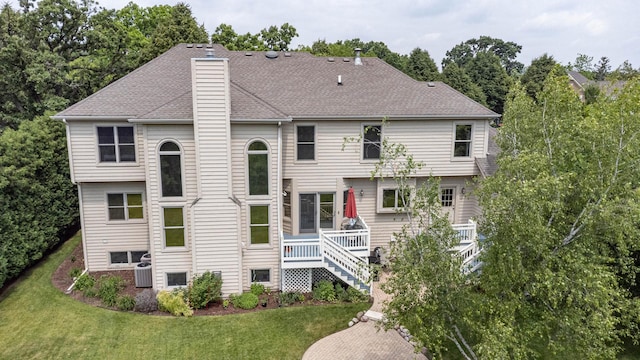 647 Oak Ln, South Elgin, IL 60177 - back of house featuring a chimney, a lawn, stairway, and a wooden deck