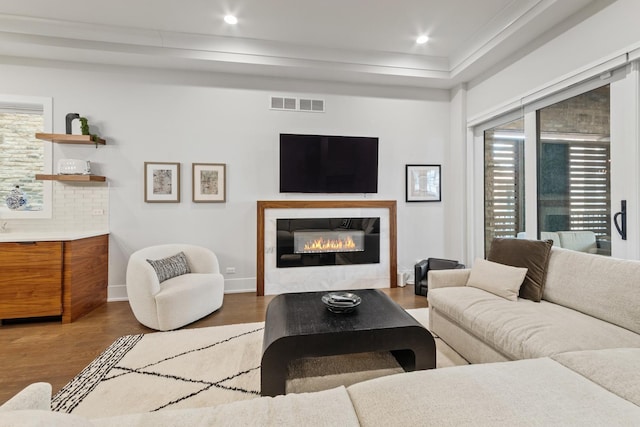 1304 N Hoyne Ave Unit 1, Chicago, IL 60622 - living area with wood finished floors, a tile fireplace, baseboards, and recessed lighting