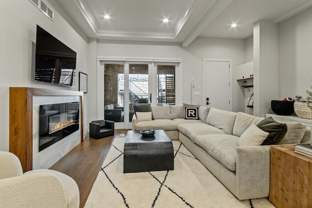 1304 N Hoyne Ave Unit 1, Chicago, IL 60622 - living area featuring wood finished floors, a glass covered fireplace, recessed lighting, and a tray ceiling