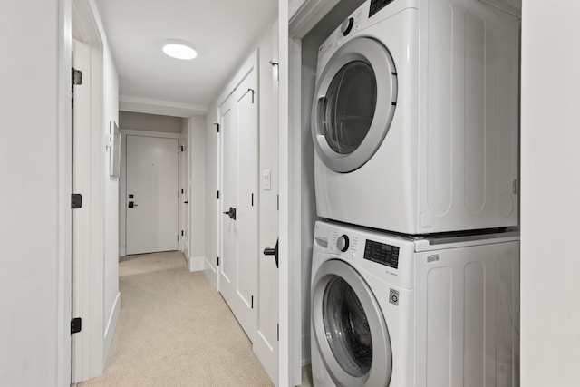 1304 N Hoyne Ave Unit 1, Chicago, IL 60622 - washroom with stacked washer / drying machine, light colored carpet, and baseboards