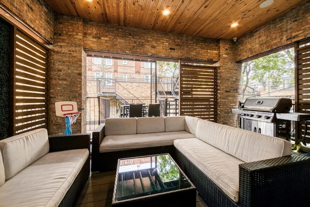 1304 N Hoyne Ave Unit 1, Chicago, IL 60622 - living room with brick wall, recessed lighting, and wooden ceiling