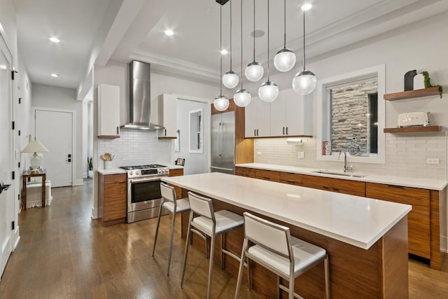 1304 N Hoyne Ave Unit 1, Chicago, IL 60622 - kitchen featuring stainless steel gas range, a sink, wall chimney exhaust hood, brown cabinets, and modern cabinets