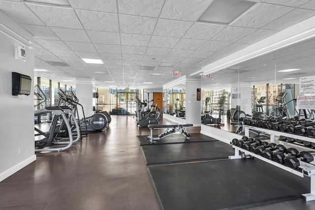 1122 N Clark St Unit 1710, Chicago, IL 60610 - exercise room featuring baseboards, a drop ceiling, and floor to ceiling windows