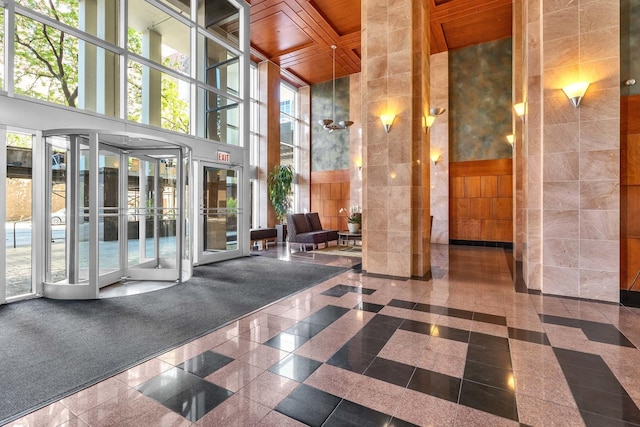 1122 N Clark St Unit 1710, Chicago, IL 60610 - lobby with a high ceiling, wooden ceiling, and tile walls