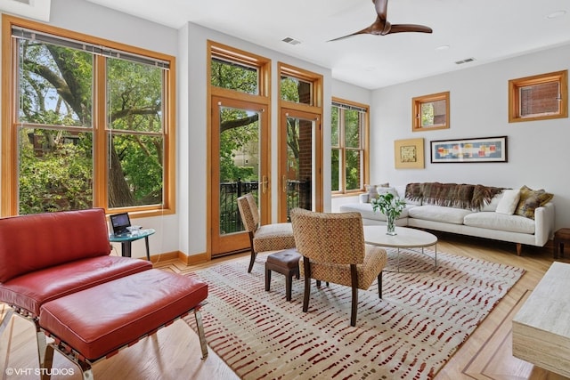 920 W Wolfram St Unit 3, Chicago, IL 60657 - living area with a ceiling fan, light wood-style floors, and baseboards