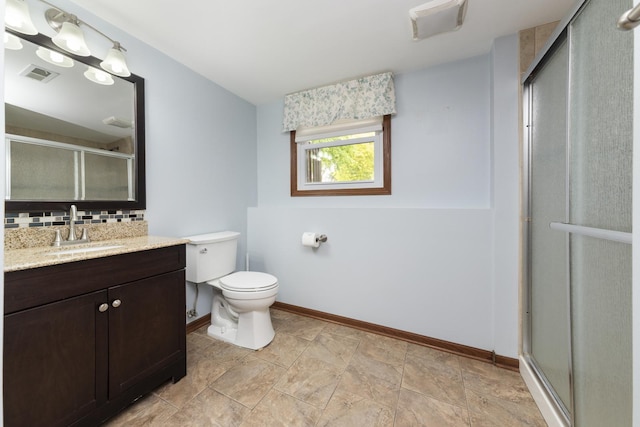 3908 Juniper Ave, Joliet, IL 60431 - full bathroom with vanity, tasteful backsplash, a shower stall, toilet, and baseboards