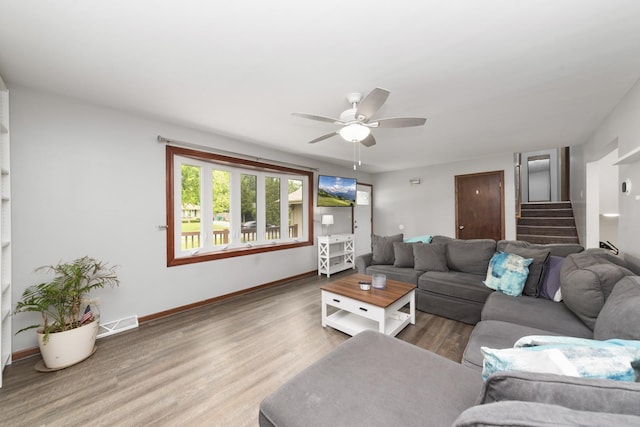 3908 Juniper Ave, Joliet, IL 60431 - living area featuring wood finished floors, ceiling fan, stairs, and baseboards