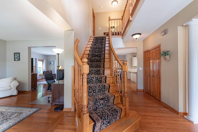 0S630 Hubbard Pl, Geneva, IL 60134 - entryway featuring stairway, light wood-type flooring, and decorative columns