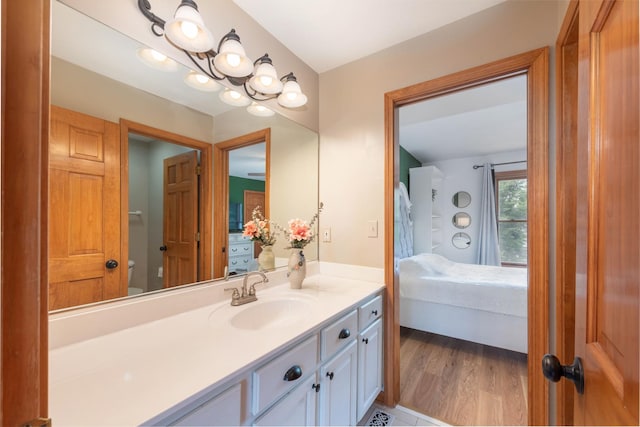 0S630 Hubbard Pl, Geneva, IL 60134 - bathroom featuring vanity, ensuite bath, and wood finished floors
