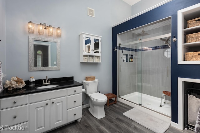 2609 Dougall Rd, Joliet, IL 60433 - bathroom featuring vanity, toilet, a shower stall, and wood finished floors
