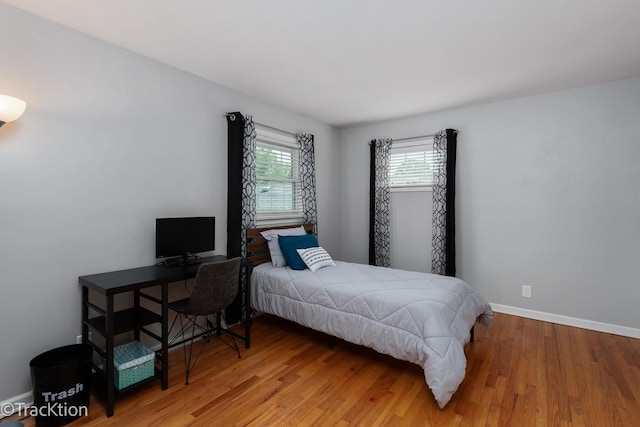 2609 Dougall Rd, Joliet, IL 60433 - bedroom featuring wood finished floors, baseboards, and a desk