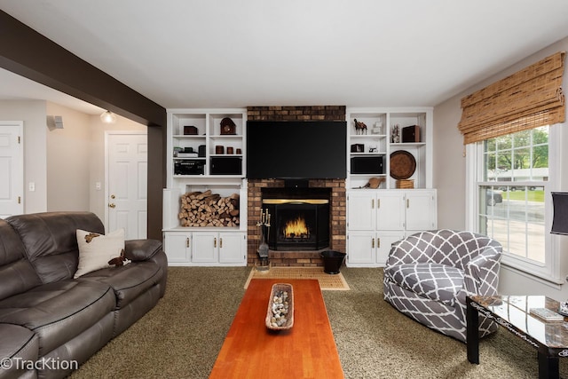 2609 Dougall Rd, Joliet, IL 60433 - living room with a fireplace, dark carpet, and built in shelves