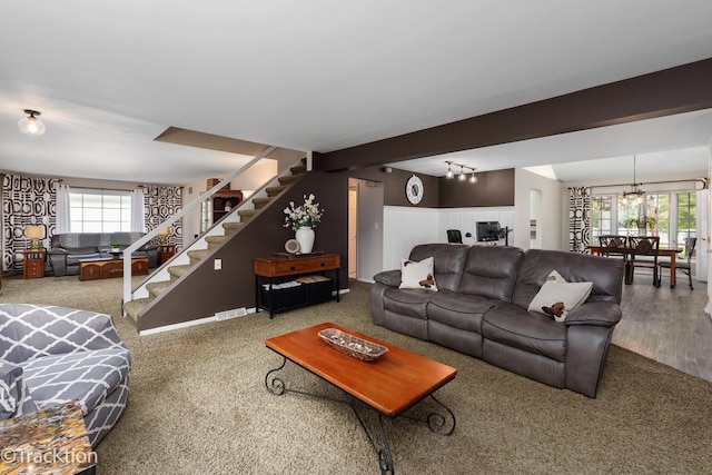 2609 Dougall Rd, Joliet, IL 60433 - carpeted living room with stairs and a chandelier